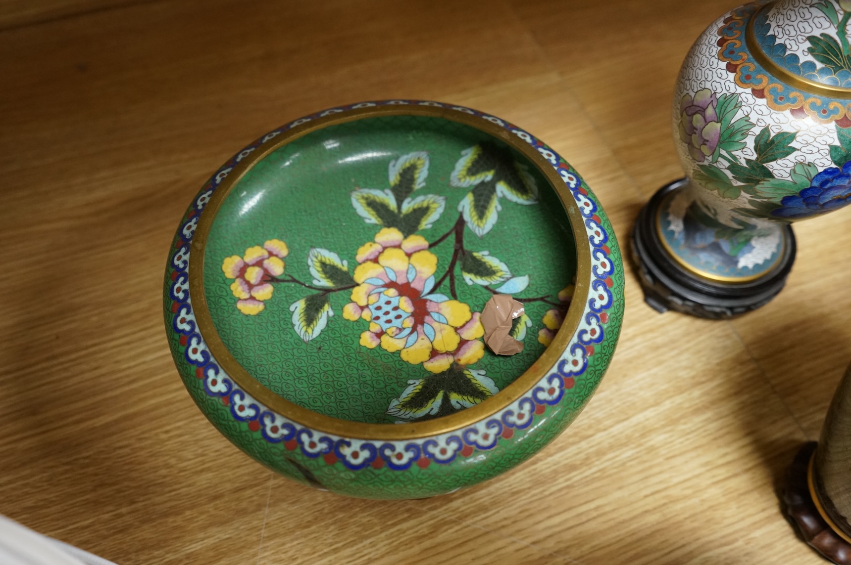 A plique a jour enamel tea bowl together with a collection of cloisonné enamel vases, bowls etc., tallest 26cm